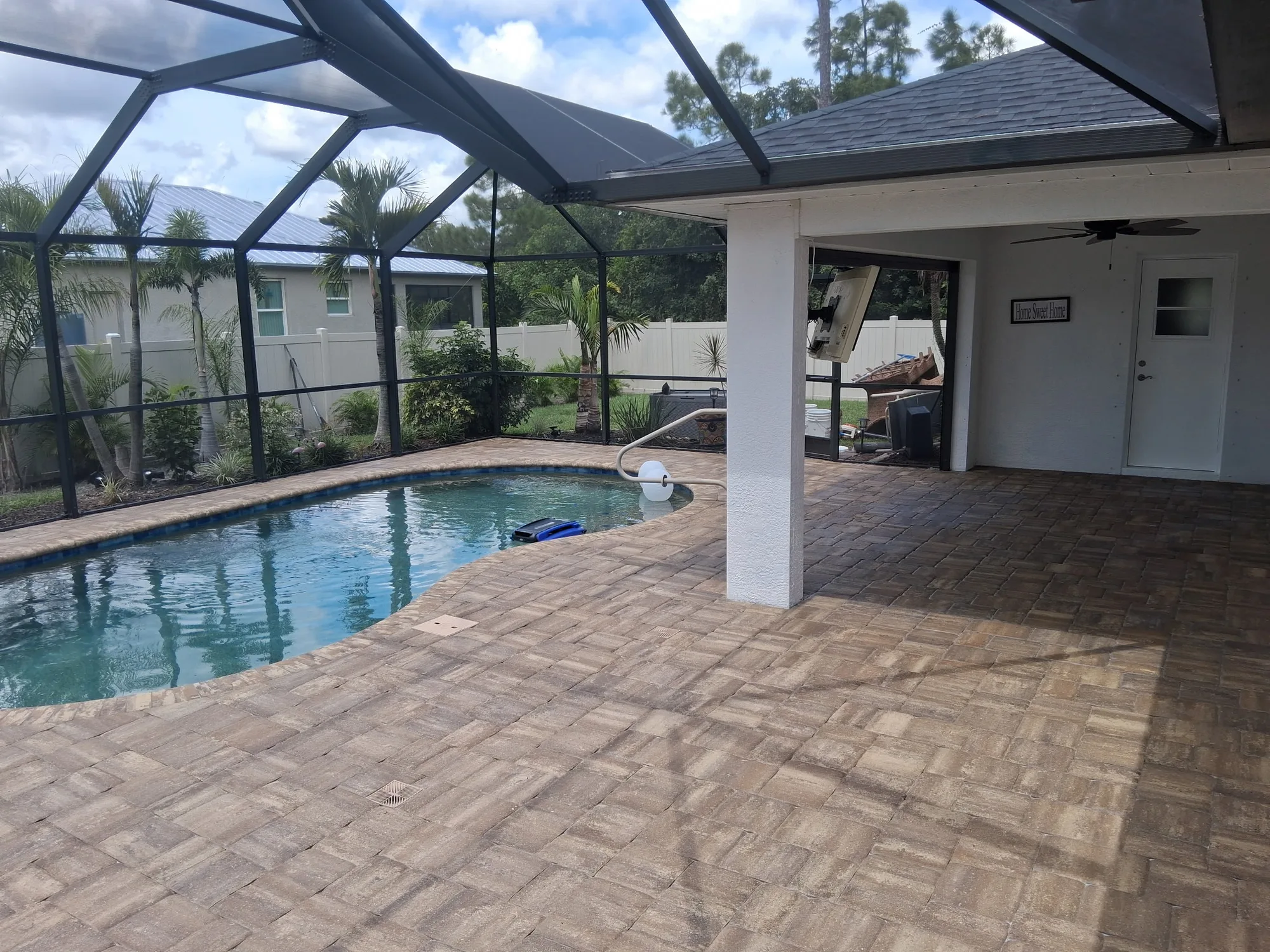 Paver pool deck and covered lanai in North Port, FL after stripping, resanding and sealing